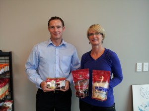 Convex Account Manager Jeremy Dimes and Sun Valley Foods General Manager Nicki Keen with four of the `new look' packs.